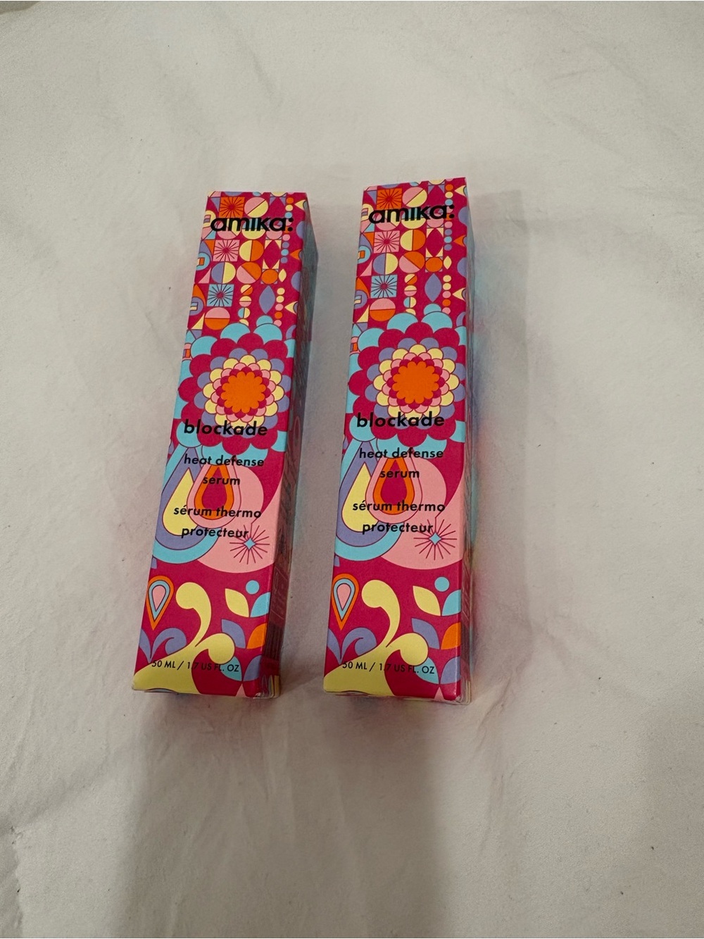 amika Blockade Heat Defense Serum - Pink & Turquoise Patterned Packaging